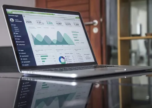 Clean data visualizations on a laptop screen.